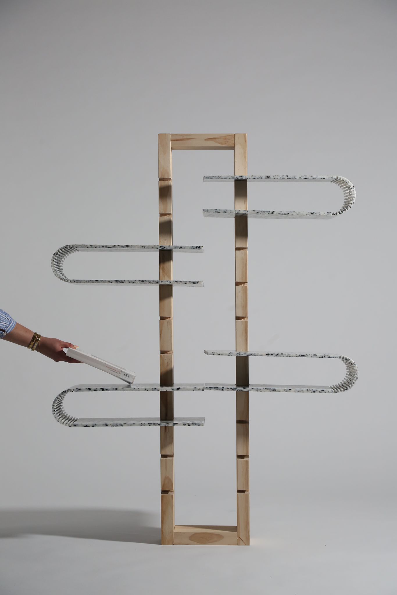 One shape today, another tomorrow: each plate is a module, repositioned to whatever the wall asks.